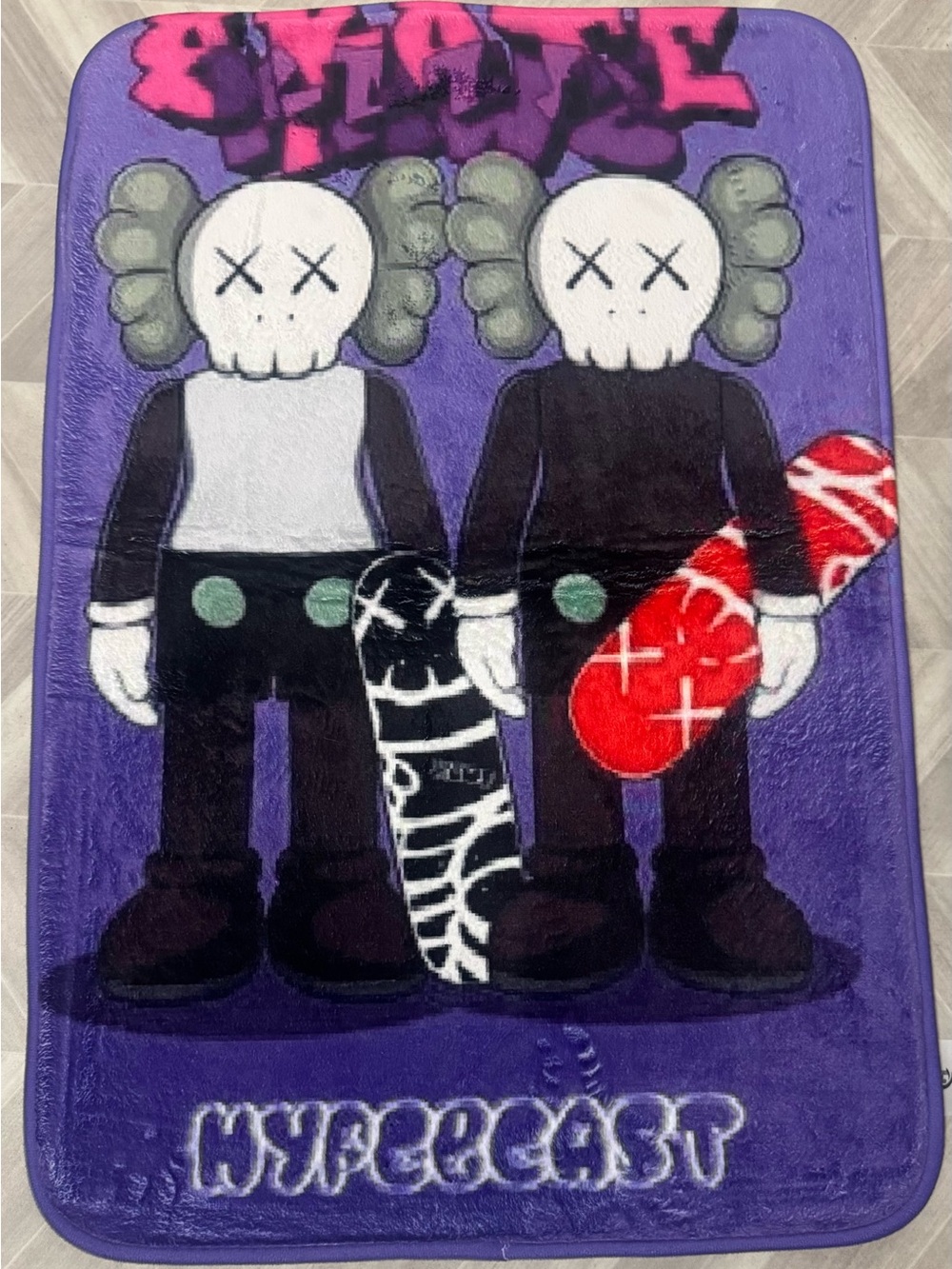 Kaws-Inspired Twin Skateboard Plush Rug in Purple and Black